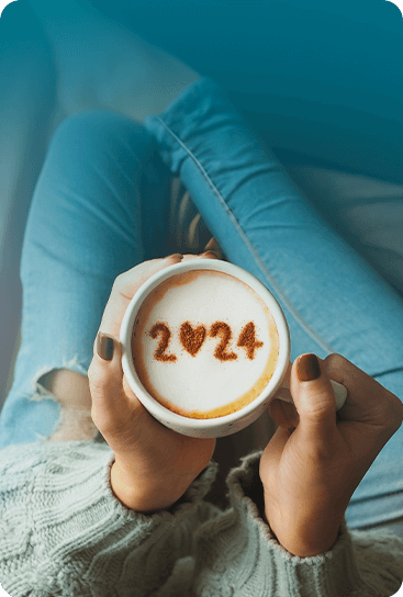A woman enjoys a cup of coffee in 2024